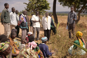 Source: Flickr (Kirk Mason/Global Devlab) Agricultural extenionist addresses farmer group in rural Malawi